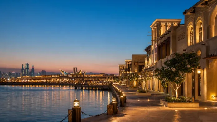 Dubai Creek waterfront at night with elegant lighting and heritage architecture