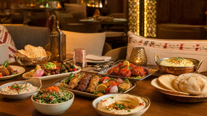 Lebanese mezze and North Indian dishes on an elegant Dubai dining table