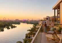 Yas Plaza Mangroves: Theme Park Staycation Yas Island staycation balcony overlooking mangroves and theme park lights in Abu Dhabi
